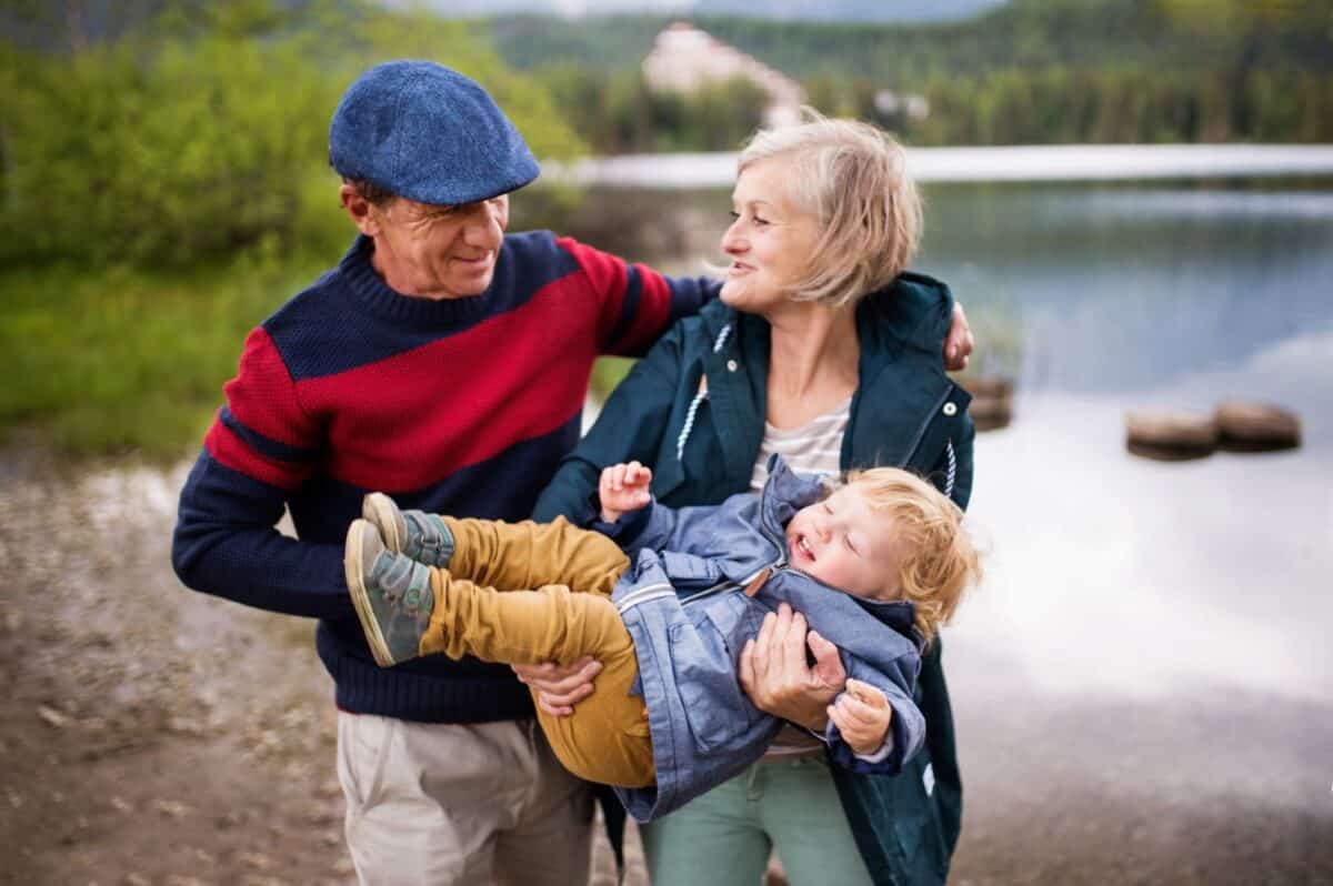 What is a Self Directed IRA; senior-couple-with-little-boy-at-the-lake