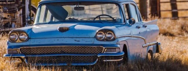 Classic American car in a country field.