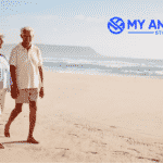 Retired couple walking on beach