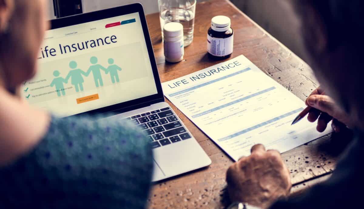get free life insurance quotes online picture of older couple completing life insurance app on computer
