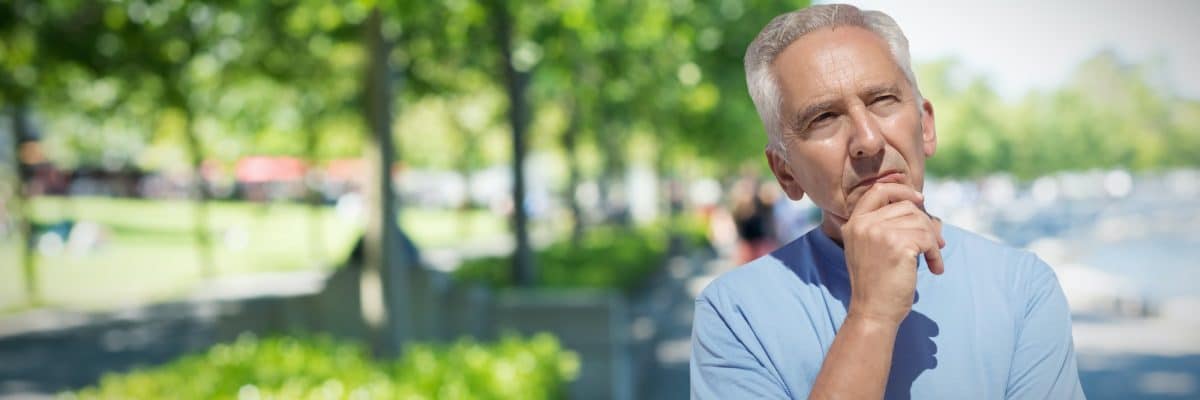 Composite image of close-up of thoughtful senior man with hand on chin