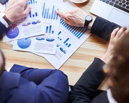 Picture of desk from above with financial statements.
